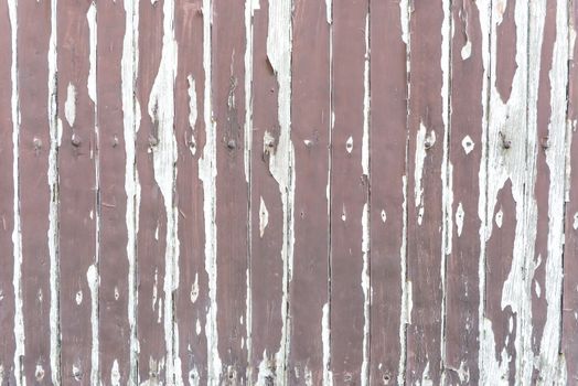 Weathered old vintage wood texture with brown paint and rusty nails, taken outdoor
