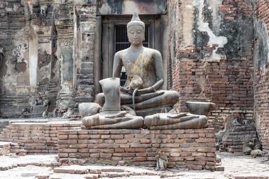 Thailand ancient old temple made from red brick and lime stones, taken on a sunny day