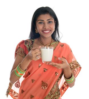 Traditional Indian woman in sari drinking milk, isolated on white background.