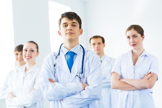 team of experienced highly qualified doctors, fold one's arms