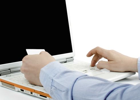 Man paying online with his credit card on white background