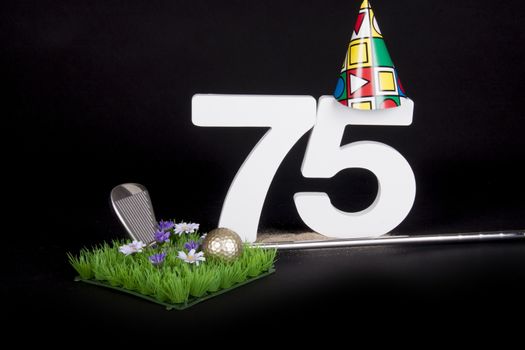 A golf club and golf ball on an artificial peace of grass to be used as a birthday card