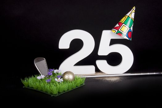 A golf club and golf ball on an artificial peace of grass to be used as a birthday card