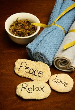 peace, love and relax words and herbs with spa products