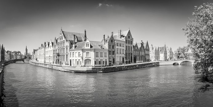 Monochrome panorama view of river canal and houses in Bruges, Belgium