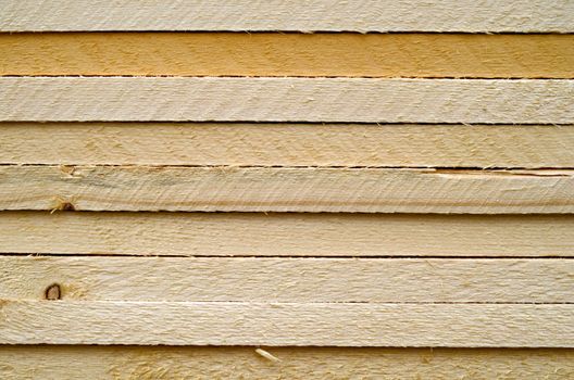 Background Texture Of Piled Planks Of Wood On A Building Site