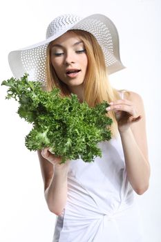 Woman with green salad leaves