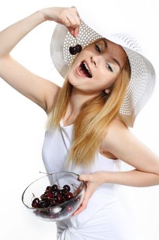 Young pretty woman with cherry on the white background