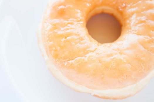 Close up sugar donut  on white dish, stock photo