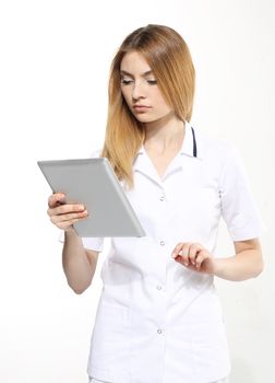 Female doctor working on digital tablet on white background