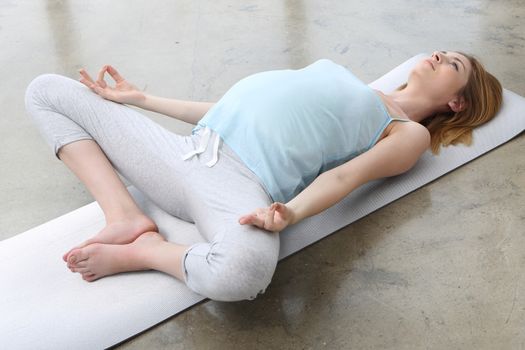 Pregnant woman doing yoga exercise