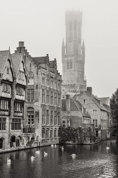 Bruges water canal and Belfry tower in monochrome vintage, Belgium