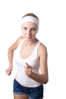 Young beautiful woman in fitness wear runs isolated over background