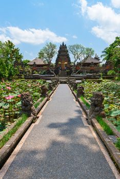 Balinese temple Pura Saraswati in Ubud with lotus flowers in ponds in front
