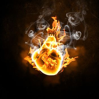 Illustration of human heart in fire flames against black background