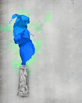 Image of paint tube with color splashes