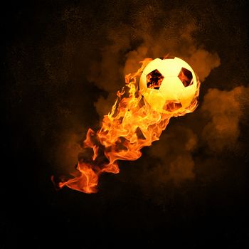 Image of soccer ball in fire flames against black background