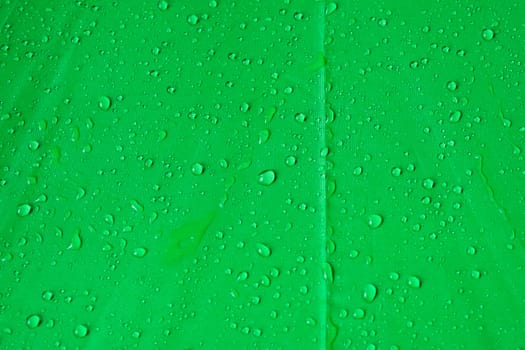 drops of water on umbrella green canvas
