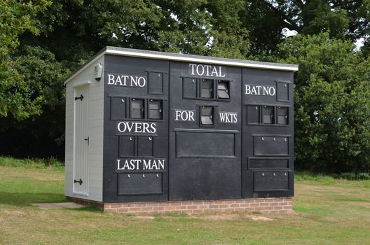 English scoreboard hut at a countryside cricket ground in Bolney village Southern England.