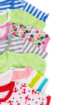 Children colored shirts isolated on white background