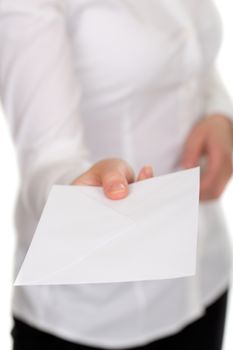 woman holds a white envelope