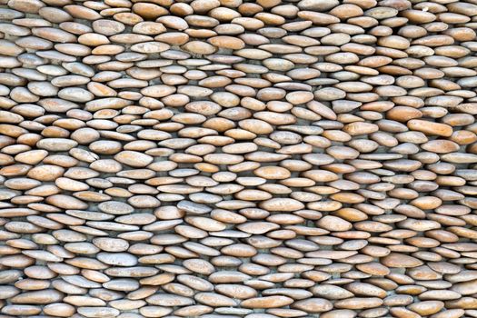 stone wall, lined with small pebbles