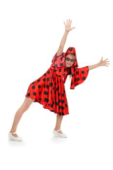 teen girl dancing in a red polka-dot dress with sunglasses. Isolate on white background