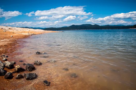 lake jocassee shore on a bright sunny day