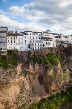 View of buildings in new town from other side of the 18th century bridge over the 300 ft Tajo Gorge in Ronda Spain