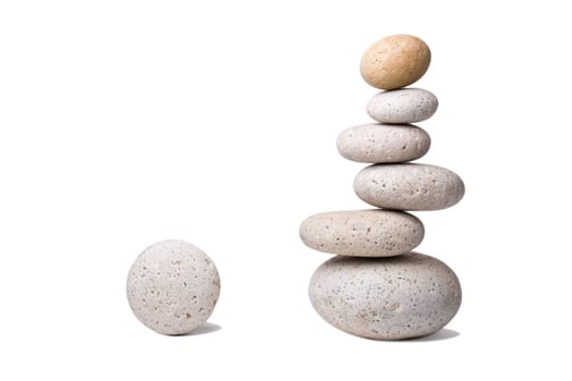 A stack of slightly off-balanced zen stones isolated on white background.