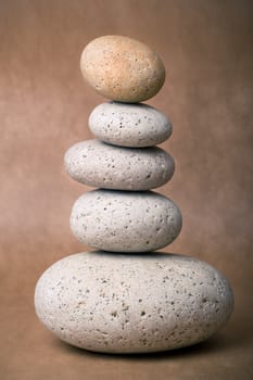 A Stack of Stones on a brown Background - a nice Zen-like Background