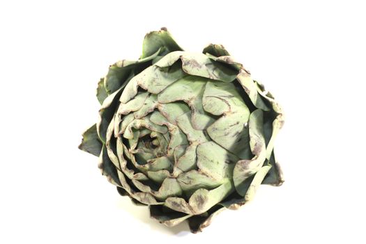 one whole artichokes on a light background