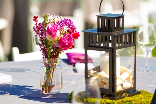 Tables, chairs, decor, and decorations at a wedding reception at an outdoor venue vineyard winery in oregon.