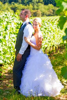 Portraits of a bride and groom outdoors in a vineyard at a winery in Oregon right after their ceremony and vows.