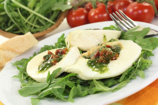 stuffed mozzarella on a rocket in front of white background