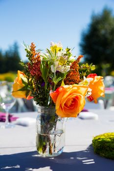 Tables, chairs, decor, and decorations at a wedding reception at an outdoor venue vineyard winery in oregon.