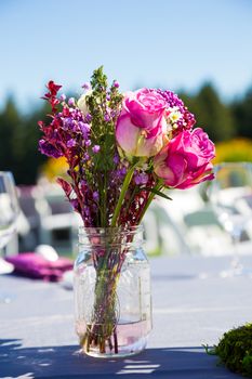 Tables, chairs, decor, and decorations at a wedding reception at an outdoor venue vineyard winery in oregon.