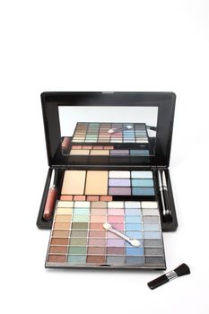 Multi colored make-up palette on white background 