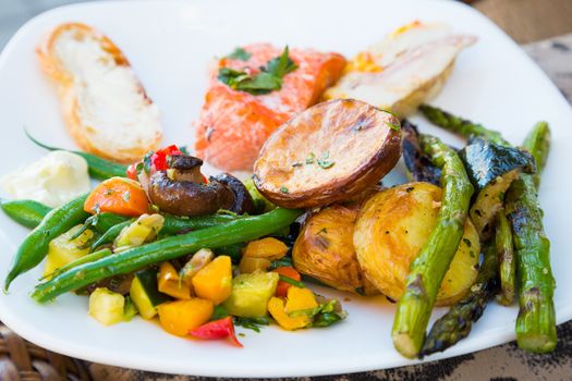 Dinner is served at this beautiful wedding reception outdoors at a vineyard.