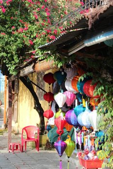 Colourful traditional silk and paper lanterns in a street shop in Hoi-An, Vietnam