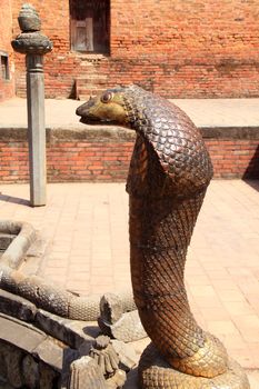 Statue of Bronze cobra in Bhaktapur, Nepal 