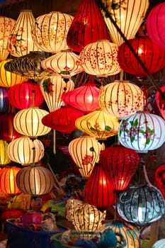 Colourful traditional silk and paper lanterns in a street shop in Hoi-An, Vietnam