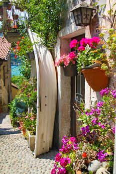 Colourful street in the small village on the Isola dei Pescatori -one of the Boromean isles in Lago Maggiore, Italy