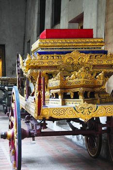 Inticately carved royal carriage in the national museum in Bangkok, Thailand