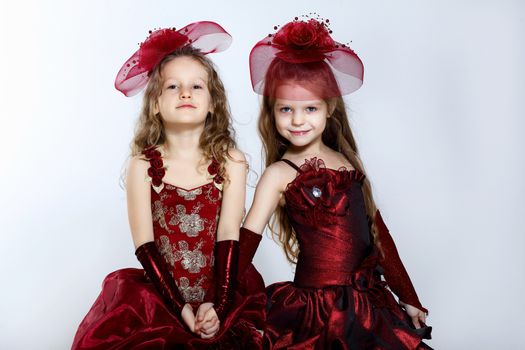 Portrait of two little girls in beautiful dresses