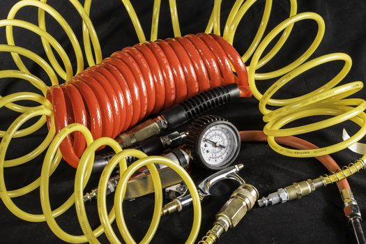 A shot of air hoses and air tools used with an air compressor.