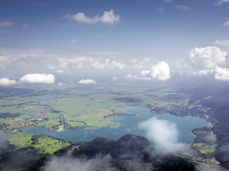 View from the top of the mountain Herzogstand in Germany Bavaria to the lake Kochelsee