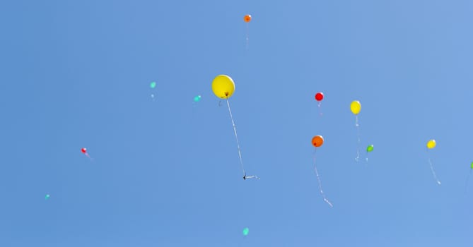 color balloons flying to the sky