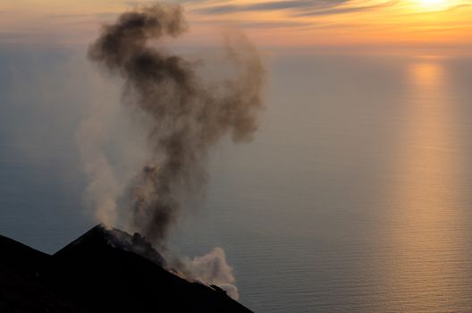 Smoking volcano at sunset on Stromboli island, Sicily, Italy