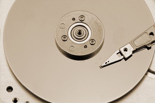 Open computer hard drive on white background with rusty color (HDD, Winchester)